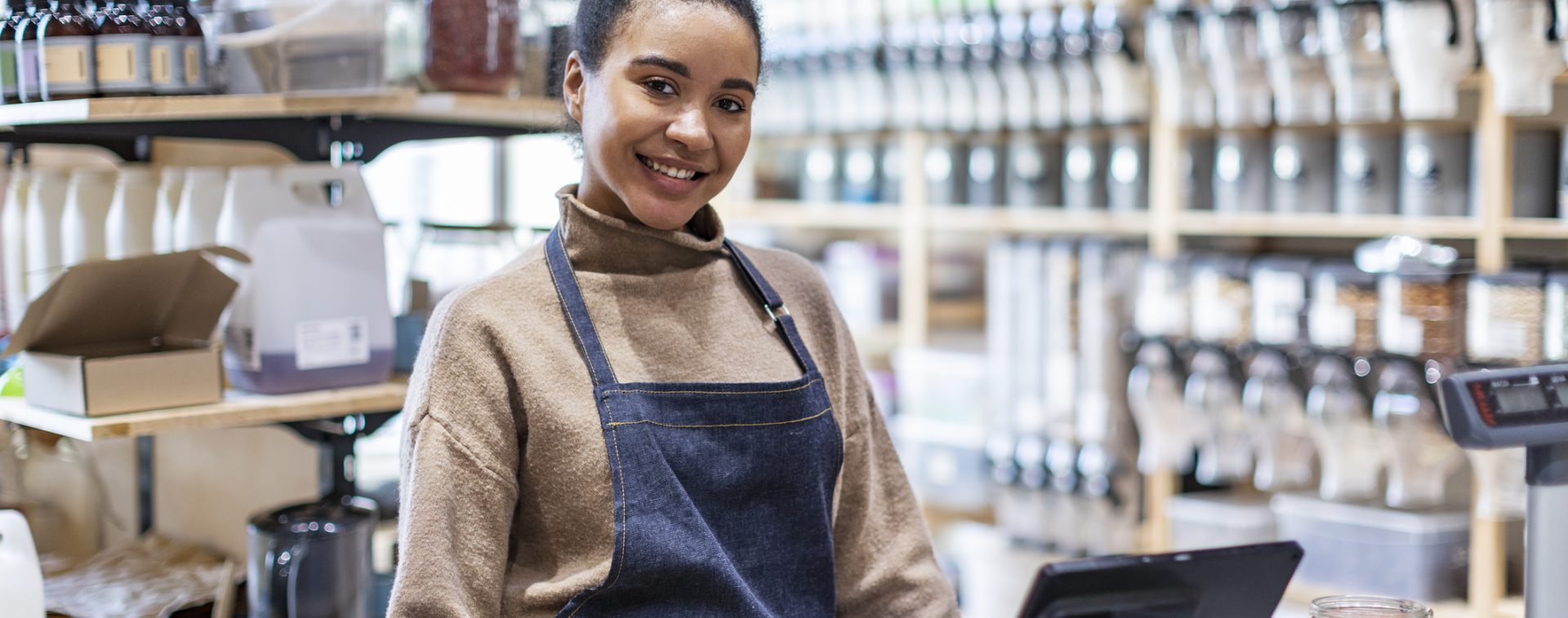 Shop assistant in zero waste store
